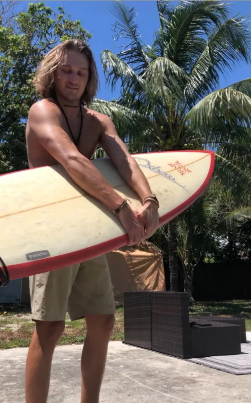 Austin with surfboard in Costa Rica